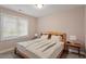 Calm bedroom featuring a wooden bed frame and neutral decor, creating a serene atmosphere at 95 Blueberry Rdg, Pittsboro, NC 27312
