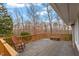 Spacious deck features wood railings and overlooks a serene wooded area at 95 Blueberry Rdg, Pittsboro, NC 27312