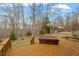 Relaxing deck area with a hot tub offering a serene woodland view, perfect for unwinding at 95 Blueberry Rdg, Pittsboro, NC 27312