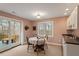 Cozy dining area featuring a round table with white table cloth and walkout to back deck at 95 Blueberry Rdg, Pittsboro, NC 27312