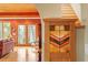 View of the home's foyer, showcasing wood floors, stairs, and stained glass at 95 Blueberry Rdg, Pittsboro, NC 27312