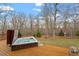 Luxurious hot tub on a wooden deck, ideal for enjoying the peaceful wooded surroundings at 95 Blueberry Rdg, Pittsboro, NC 27312