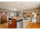 Kitchen with stainless steel appliances, wooden cabinets and island with bar seating at 95 Blueberry Rdg, Pittsboro, NC 27312