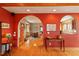 Bright living space with wood floors, arched entryways, and a view into the dining room at 95 Blueberry Rdg, Pittsboro, NC 27312