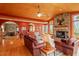 Open floor plan showcases the living room, stone fireplace, and dining area at 95 Blueberry Rdg, Pittsboro, NC 27312