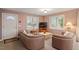 Comfortable living area featuring two sofas, neutral color palettes and natural light at 95 Blueberry Rdg, Pittsboro, NC 27312