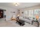 Inviting living room features large windows, neutral tones, and comfortable seating at 95 Blueberry Rdg, Pittsboro, NC 27312