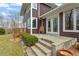 Charming outdoor patio with stone steps leading to a tranquil seating area at 95 Blueberry Rdg, Pittsboro, NC 27312