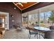 Charming sunroom with tile flooring and views of the beautifully landscaped yard at 95 Blueberry Rdg, Pittsboro, NC 27312