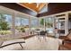 Charming sunroom with tile flooring and views of the beautifully landscaped yard at 95 Blueberry Rdg, Pittsboro, NC 27312