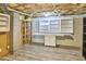 Unfinished basement showcasing storage and workspace with vinyl flooring and open ceiling at 10 Eastwind Pl, Chapel Hill, NC 27517