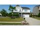 Charming two-story home with a well-maintained lawn, landscaped garden beds and a two car garage at 1001 Hope Springs Ln, Morrisville, NC 27560