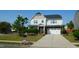 Charming two-story home with a well-maintained lawn, landscaped garden beds and a two car garage at 1001 Hope Springs Ln, Morrisville, NC 27560