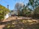 Expansive backyard with mature trees and plenty of space for outdoor activities and entertaining at 101 Tiverton Woods Dr, Holly Springs, NC 27540