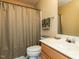 Bathroom showcasing a functional design with a vanity sink and a shower with a patterned curtain at 101 Tiverton Woods Dr, Holly Springs, NC 27540
