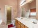 Well-lit bathroom featuring double vanity sinks and updated fixtures at 101 Tiverton Woods Dr, Holly Springs, NC 27540