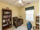 Bright bedroom featuring a bookshelf, chair, and ceiling fan at 101 Tiverton Woods Dr, Holly Springs, NC 27540