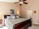 Bright bedroom featuring a ceiling fan and neutral decor at 101 Tiverton Woods Dr, Holly Springs, NC 27540
