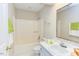 Bright bathroom with a shower-tub combo, white cabinets, and tile floors at 103 Kirkwood Dr., Chapel Hill, NC 27514