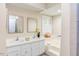 Spacious bathroom with double vanities, soaking tub, and bright natural light from a window at 103 Kirkwood Dr., Chapel Hill, NC 27514