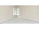 Bedroom with neutral carpet and double hung windows with blinds at 103 Kirkwood Dr., Chapel Hill, NC 27514