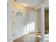 Bright foyer with tiled floors, white doors, and traditional columns at 103 Kirkwood Dr., Chapel Hill, NC 27514