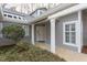 Charming home entrance featuring a covered porch and mature landscaping at 103 Kirkwood Dr., Chapel Hill, NC 27514