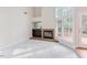 Spacious living area with fireplace, wet bar, and abundant natural light at 103 Kirkwood Dr., Chapel Hill, NC 27514