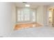 Sitting room area with carpet and bright light with door to outside at 103 Kirkwood Dr., Chapel Hill, NC 27514