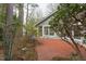 A covered patio extends the living space outdoors providing beautiful views of the landscape at 103 Kirkwood Dr., Chapel Hill, NC 27514