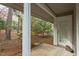 A cozy porch invites you to enjoy the peaceful surroundings and adds to the home's exterior charm at 103 Kirkwood Dr., Chapel Hill, NC 27514