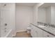 Bathroom featuring a tub and shower combo and white vanity with granite countertops at 103 Shelfit Trl, Oxford, NC 27565