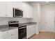 This kitchen features granite countertops, stainless steel appliances, and crisp white cabinets at 103 Shelfit Trl, Oxford, NC 27565