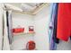 This walk-in closet has wood shelving and hanging storage for an organized and tidy space at 104 Barnes Spring Ct, Cary, NC 27519