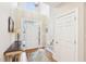 Bright foyer with hardwood floors, a staircase, a coat closet, and a soaring ceiling at 104 Barnes Spring Ct, Cary, NC 27519