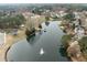 An aerial shot of the neighborhood pond, playground and bridge to gazebos at 105 Aberson Ct, Cary, NC 27519
