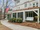Backyard featuring a screened-in porch with a swing and a spacious deck with an American flag at 105 Aberson Ct, Cary, NC 27519