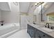 Bright bathroom with a soaking tub, shower and vanity with double sinks at 105 Aberson Ct, Cary, NC 27519