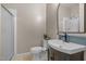 Half bathroom has a toilet, modern vanity, sink, and a walk in shower at 105 Aberson Ct, Cary, NC 27519
