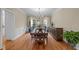 Formal dining room with a large table, chandelier, and wainscoting at 105 Aberson Ct, Cary, NC 27519