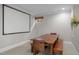 Dining area with a large wooden table and bench seating, perfect for Gathering meals at 105 Aberson Ct, Cary, NC 27519