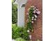 Charming brick exterior adorned with climbing flowers on trellis, adding a touch of natural beauty at 105 Aberson Ct, Cary, NC 27519