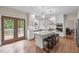 Modern kitchen with white cabinets, marble countertops, and stainless steel appliances at 105 Aberson Ct, Cary, NC 27519