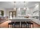 Spacious kitchen with a center island, pendant lighting, stainless steel appliances, and hardwood floors at 105 Aberson Ct, Cary, NC 27519