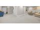 Spacious basement living area with neutral carpet, offering a versatile space for recreation and relaxation at 105 Aberson Ct, Cary, NC 27519