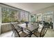 Enclosed sunroom with a tile table and seating for six, perfect for dining with a view at 105 Aberson Ct, Cary, NC 27519