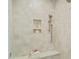 Detailed shot of a bright, tiled shower with built-in niche and bench at 109 W Markham Ave, Durham, NC 27701