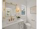 Elegant bathroom featuring gold hardware, a large mirror, and modern decor at 109 W Markham Ave, Durham, NC 27701