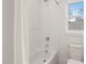 Bright bathroom showcasing a shower-tub combo with white subway tile and a window at 109 W Markham Ave, Durham, NC 27701