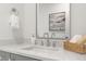 Modern bathroom with white quartz counters and chrome fixtures at 109 W Markham Ave, Durham, NC 27701
